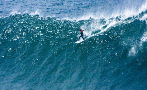 A surfer takes on a monster wave near North Wall at Ballina. A surfer takes on a monster wave near North Wall at Ballina.